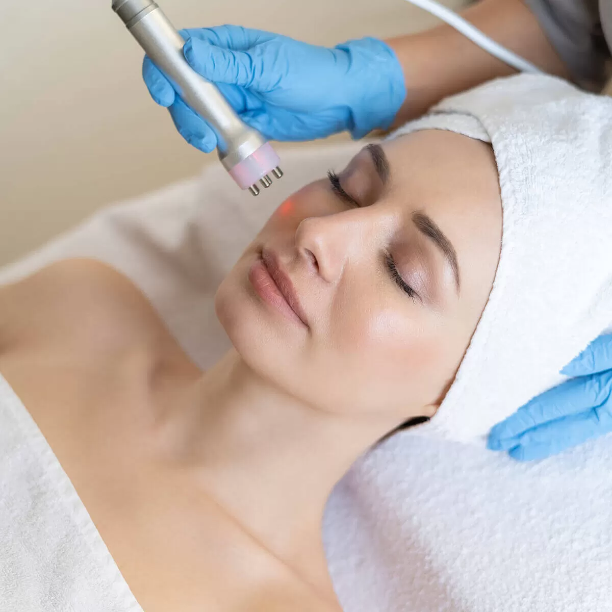 young-woman-lying-cosmetologist-s-table-during-rejuvenation-procedure-cosmetologist-take-care-about-neck-face-skin-youthfull-wellness-hardware-face-cleaning-procedure