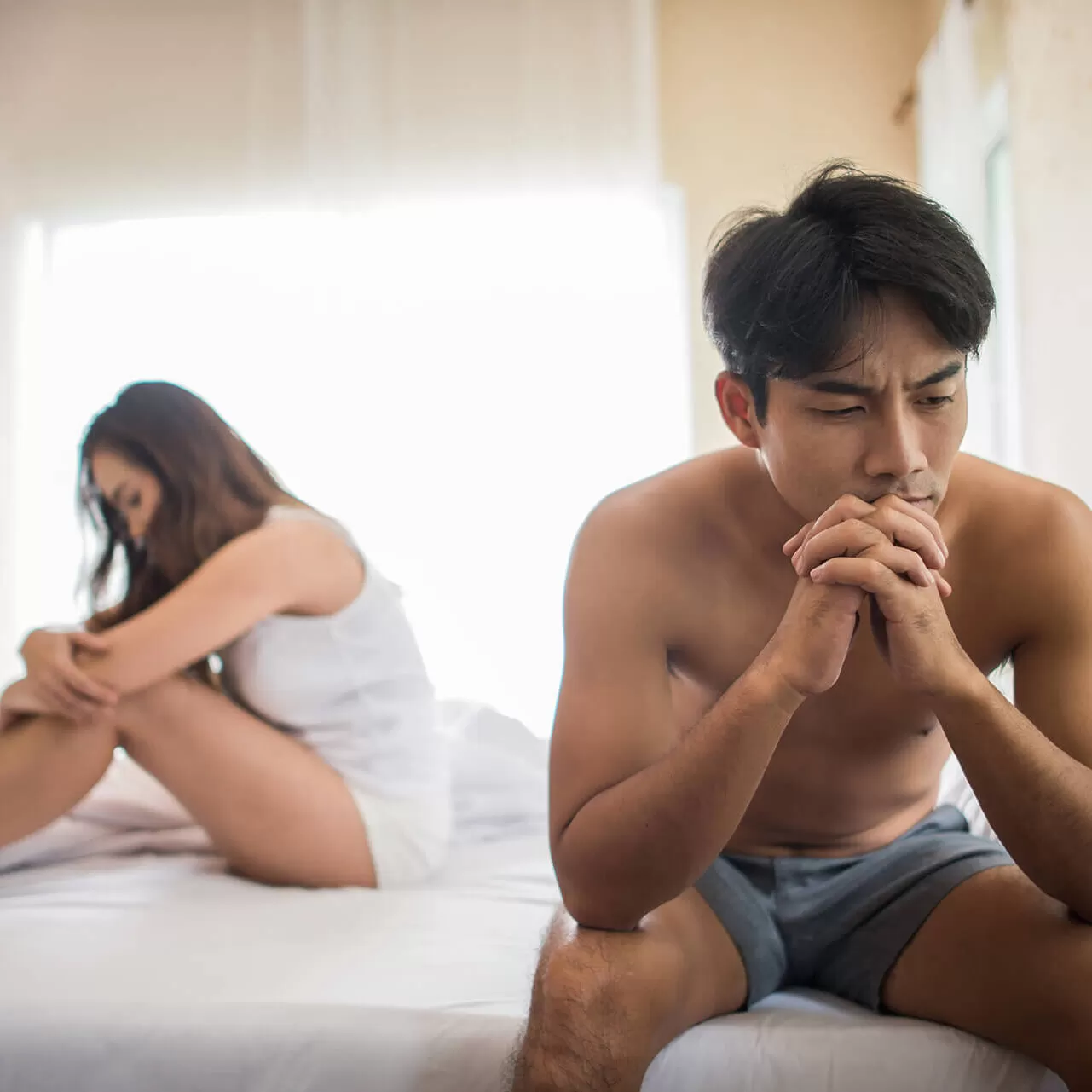 depressed-man-sitting-bed-bedroom-have-problem-with-his-wife (1)